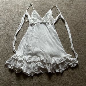White dress from the beach with an open back and size small.